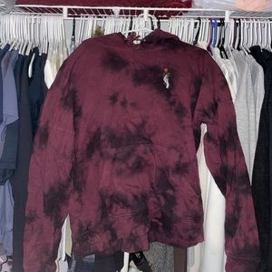 tye-dye sweatshirt with skeleton hand holding rose detail